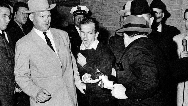 Lee Harvey Oswald grimaces as he is shot and fatally wounded by Jack Ruby. Photograph: Bob Jackson/Dallas Times-Herald/AP