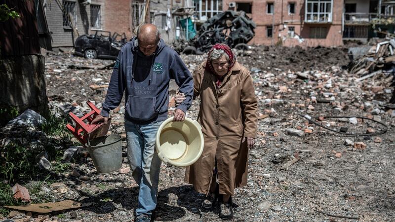 Residents salvage what they can from an apartment complex  bombed by Russian forces  in the frontline town of Bakhmut, in Ukraine’s eastern Donetsk region. Photograph: Finbarr O’Reilly/New York Times