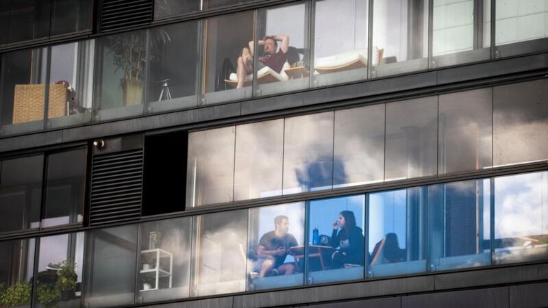 People on their balconies in Grand Canal Dock. Photograph: Tom Honan