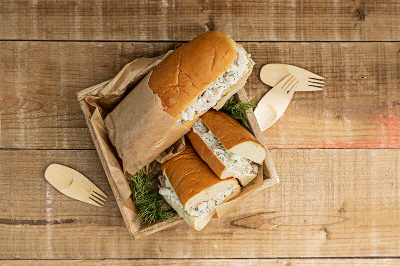 Dainty frozen prawns with avocado, herbs and creme fraiche.