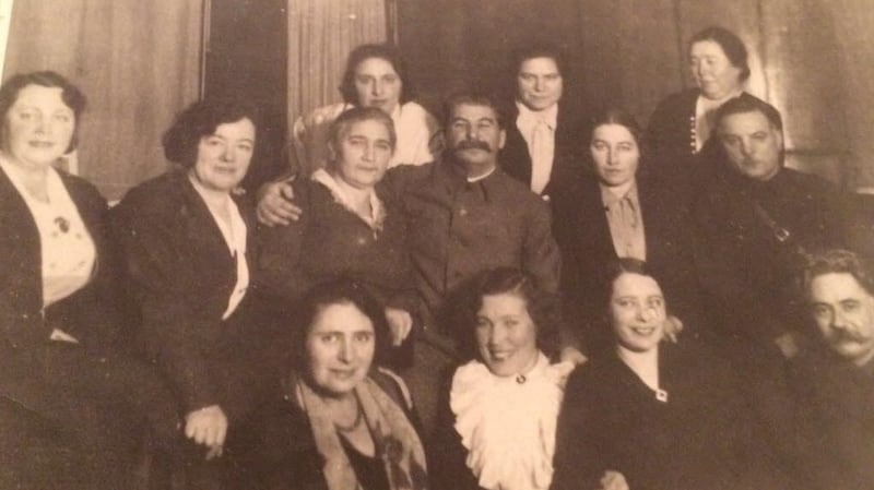 Stalin with Elena Alliloueva-Lorigan’s great-grandmother Eugeniya (bottom row wearing white top. Stalin is standing directly behind her).