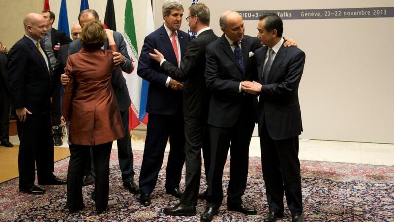 British foreign secretary William Hague (left), Germany’s foreign minister Guido Westerwelle (third right), EU high representative for foreign affairs and security policy Catherine Ashton (fifth right), Iranian foreign minister Mohammad-Javad Zarif (not pictured), Chinese foreign minister Wang Yi (right), US secretary of state John Kerry (fourth right), Russian foreign minister Sergey Lavrov (not pictured), French foreign minister Laurent Fabius (second left), are seen during a ceremony at the UN in Geneva after the Iran deal was reached.  Photograph: EPA