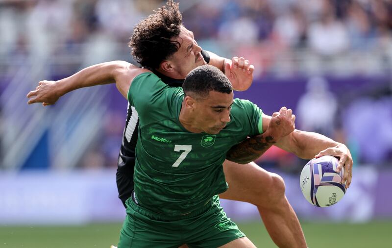 Jordan Conroy scoring a try in Paris despite the attention of New Zealand's Leroy Carter. Photograph: Dan Sheridan/Inpho