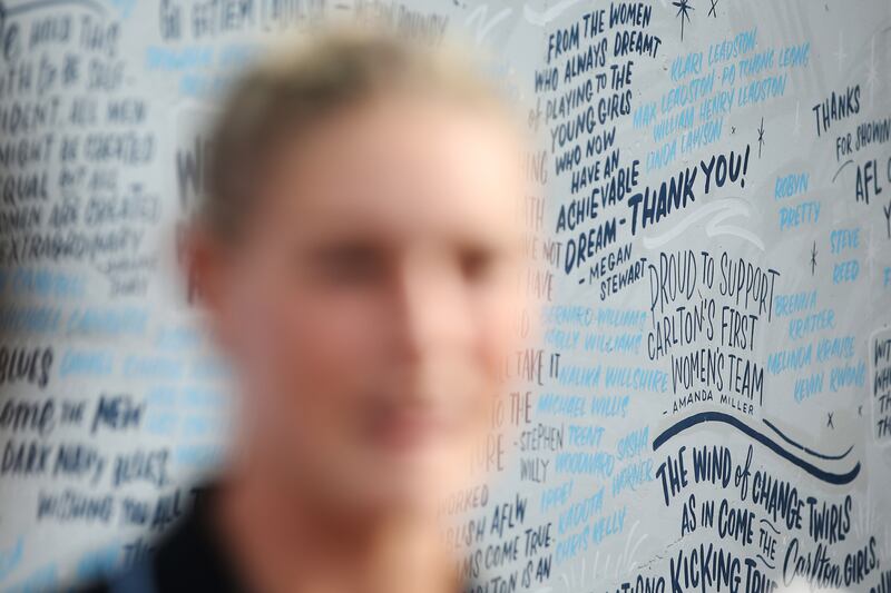 Tayla Harris: Carlton’s star forward in front of messages in support of women’s football in Melbourne today. Photograph: Michael Dodge/Getty