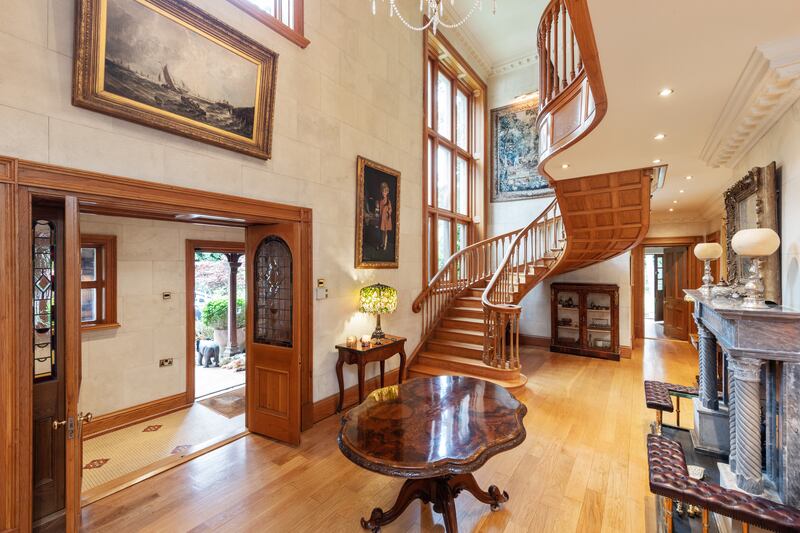Entrance hallway with bespoke French oak cantilevered staircase