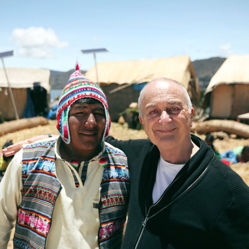 Around the World by Train: Tony Robinson with one of the Uros people, who live on floating islands on Lake Titicaca, in South America. Photograph: Rumpus Media/Channel 5