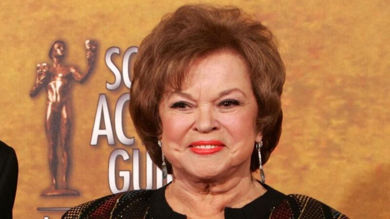 2006: Shirley Temple Black poses with the Screen Actors Guild Awards life achievement award in Los Angeles. Photograph: AFP