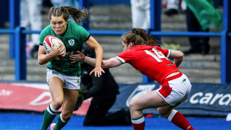 Ireland’s Béibhinn Parsons takes on Lisa Neumann of Wales during the Women’s Six Nations match at Cardiff Arms Park. Photograph: Robbie Stephenson/Inpho