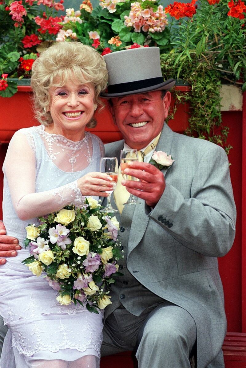Barbara Windsor as the bride Peggy Mitchell and Mike Reid as the groom Frank Butcher in Eastenders.  Photograph: John Stillwell/PA