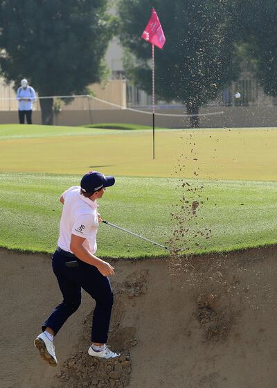 Paul Dunne plays a shot from a plugged lie at the 10th. Photo: David Cannon/Getty Images