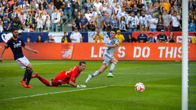 Robbie Keane scores the winning goal for LA Galaxy in the MLS Cup final at the StubHub Center in Los Angeles, California. Photograph: Robert Laberge/Getty Images