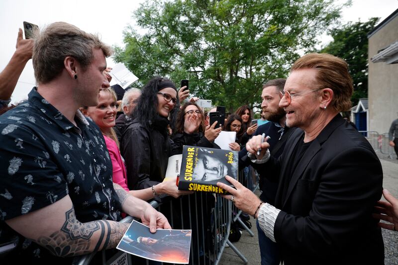 Bono greets fans while leaving the festival. Photograph: Conor McCabe Photography