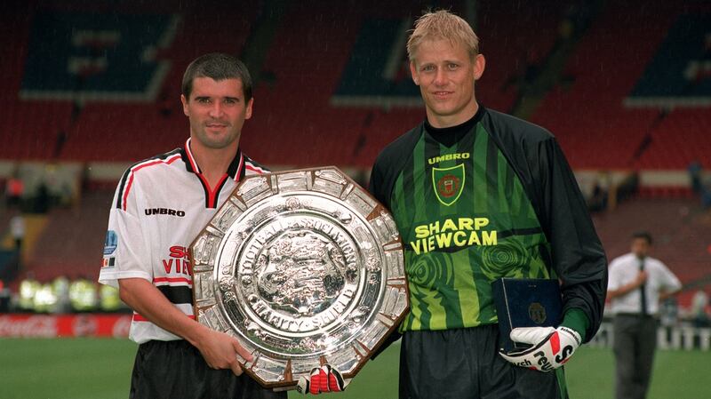 Keane and Schmeichel pose with the Charity Shield in 1997. Photo: Popperfoto/Getty Images