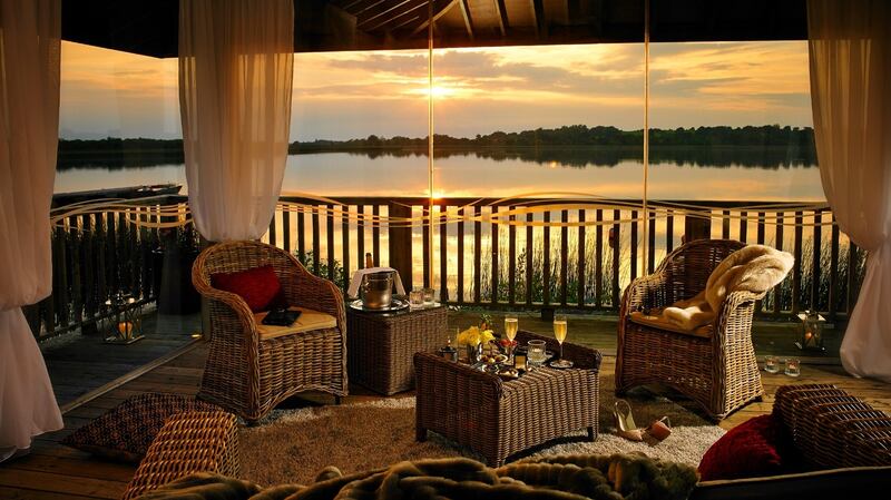 Relax on the deck at the Wineport Lodge, looking out over Lough Ree