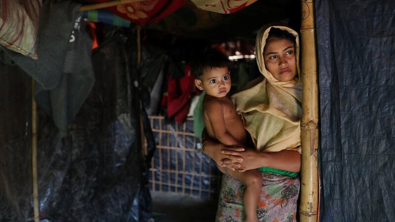 Rehana Khatun, whose husband Mohammed Nur was among 10 Rohingya men killed by Myanmar security forces and Buddhist villagers on September 2nd, with her child  at Kutupalong camp in Cox’s Bazar, Bangladesh. Photograph: Mohammad Ponir Hossain/Reuters