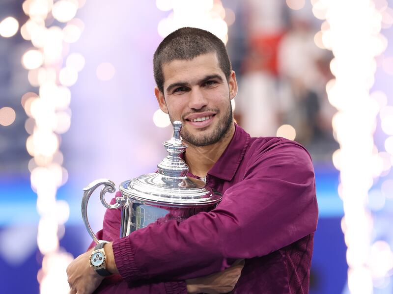 Carlos Alcaraz poses with his trophy after defeating Jannik Sinner during their men's singles final match of the 2025 US Open. Photograph: Clive Brunskill/ Getty Images