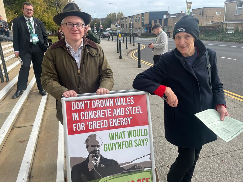 Havard Hughes and Mari Mitchell, campaigners against onshore wind farms, outside the Plaid conference