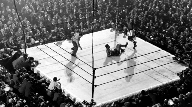 Joe Louis lies on the canvas after being floored by contender Jersey Joe Walcott in a championship fight that Louis came back to win by controversial decision at Madison Square Garden in 1947. Photo: Gjon Mili//Time Life Pictures/Getty Images
