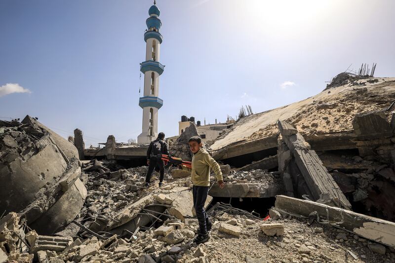 Palestinian children play on the rubble of a destroyed mosque in the middle of the Shaboura, Rafah in Gaza earlier this week. Photograph: Yasser Qudihe/Middle East Images/AFP via Getty Images