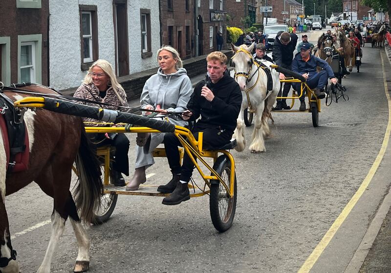 A procession of carts go through Appleby village. Photograph: Mark Paul