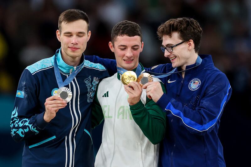 Irish gold medalist Rhys McClenaghan is flanked by silver medalist Nariman Kurbanov of Kazakhstan and bronze winner Stephen Nedoroscik of USA. Photograph: James Crombie/Inpho