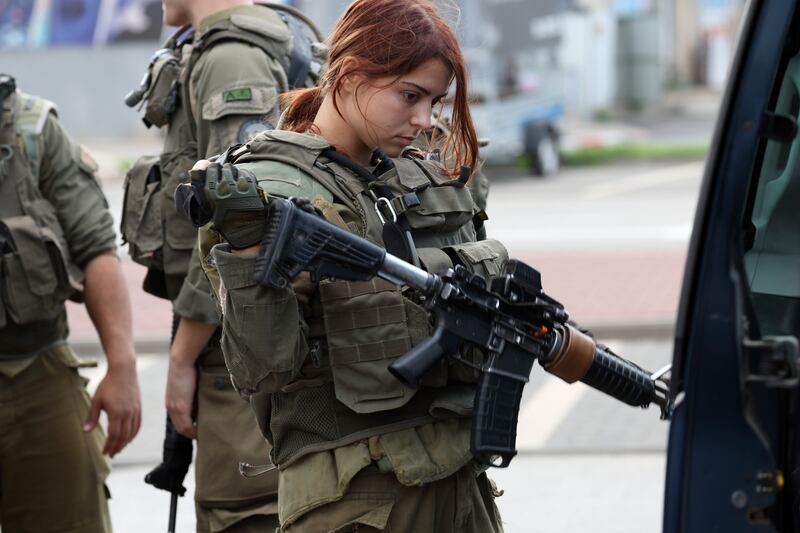 An Israeli soldier holds her weapon ahead of a patrol, in Kiryat Shmona, northern Israel, on October 20th. Photograph: Atef Safadi/EPA/Getty Images