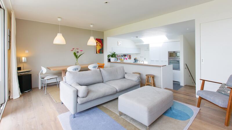 The living-dining-kitchen area, which occupies the upstairs of the house