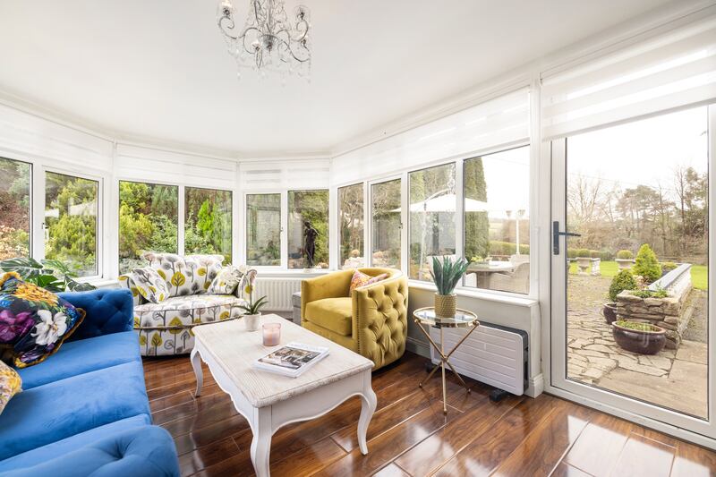 The conservatory opening on to a patio at the right of the property. Photograph: Andrew Nolan Photography