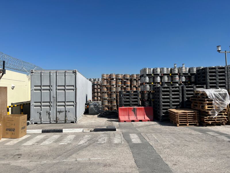 High walls with razor wire ring a retail location of the Qatar Distribution Company in Doha, Qatar. Photograph: Andrew Keh/The New York Times