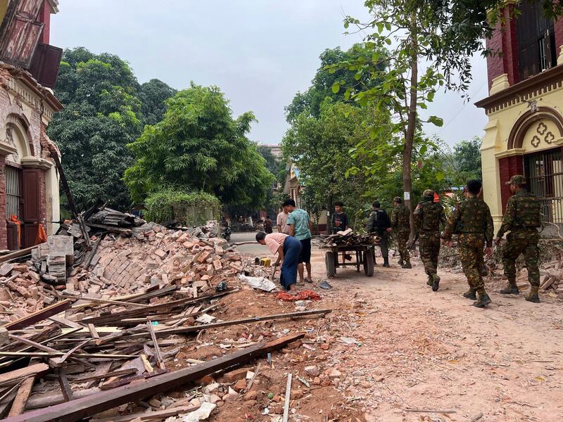 Soldiers inside the Old Masoeyein monastery, in Mandalay, Myanmar, after the destruction wrought by by the earthquake. Photograph: New York Times