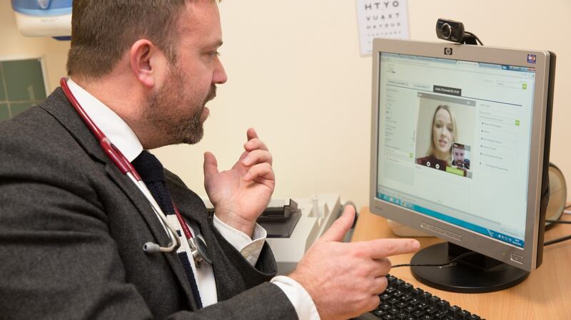 Dr Darach Ó Ciardha, Jobstown family practice, Tallaght, Dublin with (on screen) Mary O’Brien, co-founder and chief executive, of VideoDoc at the official launch of online video consultations for patients in Tallaght, Dublin.
