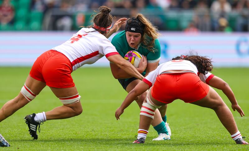 Ireland's Ellena Perry comes is tackled by Spain's Lourdes Alameda and Lia Pineiro during the Women's Rugby World Cup Pool C game at Franklin's Gardens. Photograph: Ben Brady/Inpho