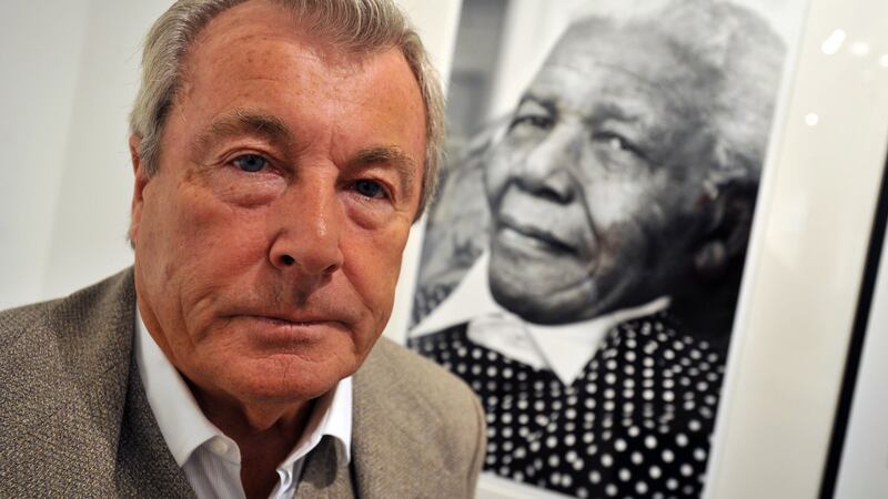 British photographer Terry O’Neill poses in front of his work, titled Nelson Mandela at 90, during a press preview of the charity auction Art for Africa at Sotheby’s auction house in London,  in  September 2009. File photograph: Daniel Deme/EPA