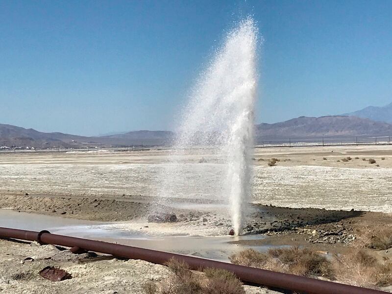 Water sprays from a burst pipe  in Trona, California following an earthquake on Thursday. Photograph: Matt Hartman/AP