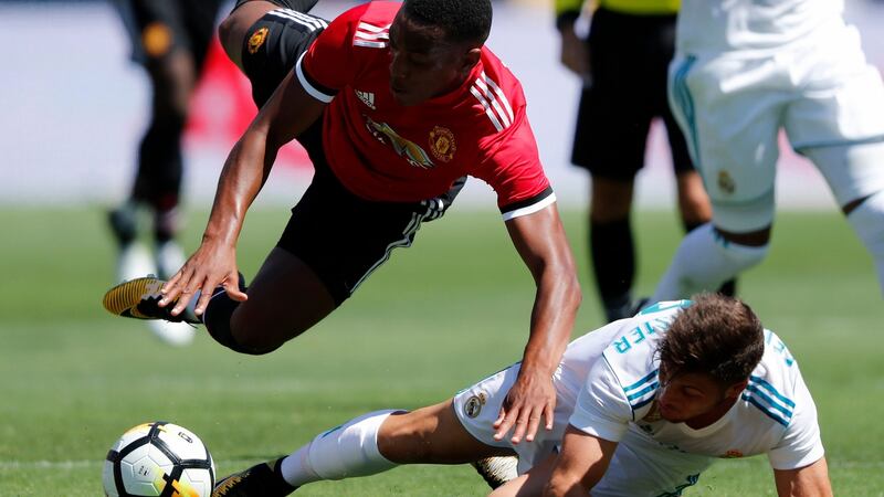 Pogba is tackled by Francisco Feuillassier. Photo: John G Mabanglo/EPA