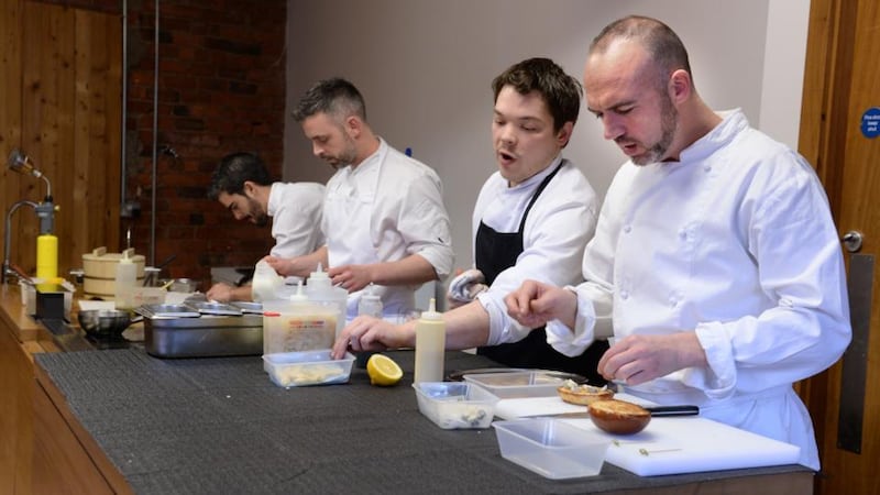 Chef Dylan McGrath, on right, in his new development kitchen in Dublin with, from left:  Luciano Sinagoga, David Rivero and Bernard McGuane.  Photograph: Dara Mac Dónaill