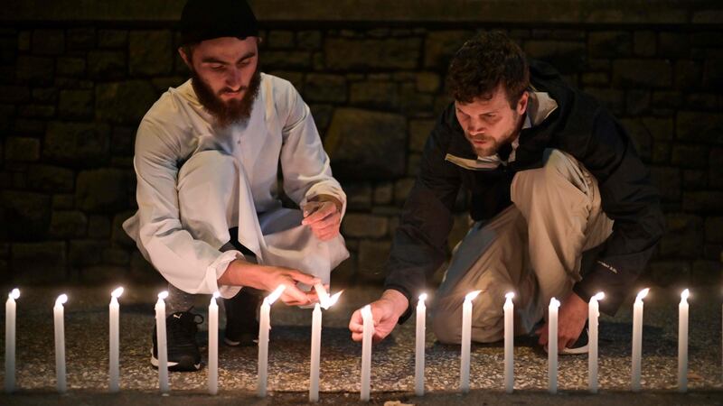 Well-wishers light 49 candles as they pay respects to victims outside the hospital in Christchurch on March 16, 2019, after a shooting incident at two mosques in the city the previous day. Photograph: Anthony Wallace/AFP