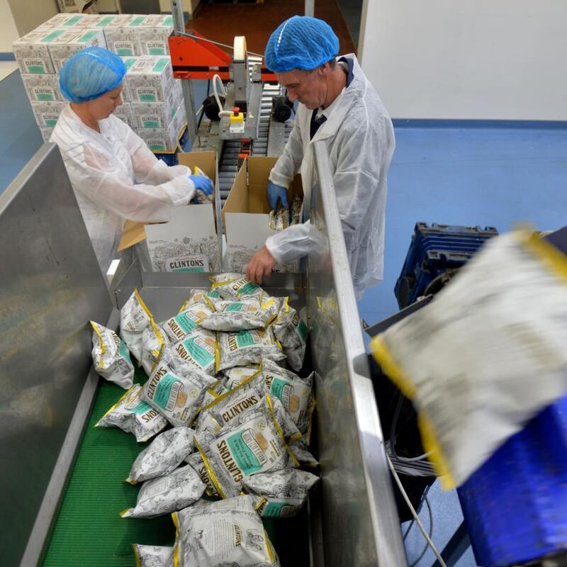 Bags come on a big roll of shiny paper, and are clamped shut on three sides before the crisps drop in. Photograph: Alan Betson