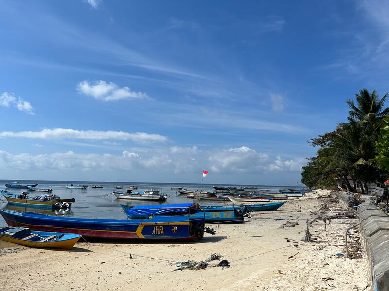 Boats along the shore at Run, at the Spice or Maluku Islands, Indonesia. Photograph: Gemma Tipton