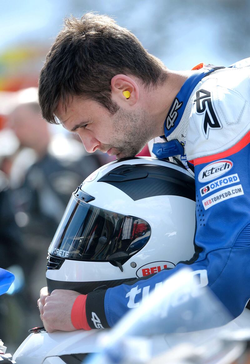 William Dunlop during a quiet moment before the action begins at the Tandragee in Co Armagh, 2012. Photograph: Stephen Davison/Pacemaker
