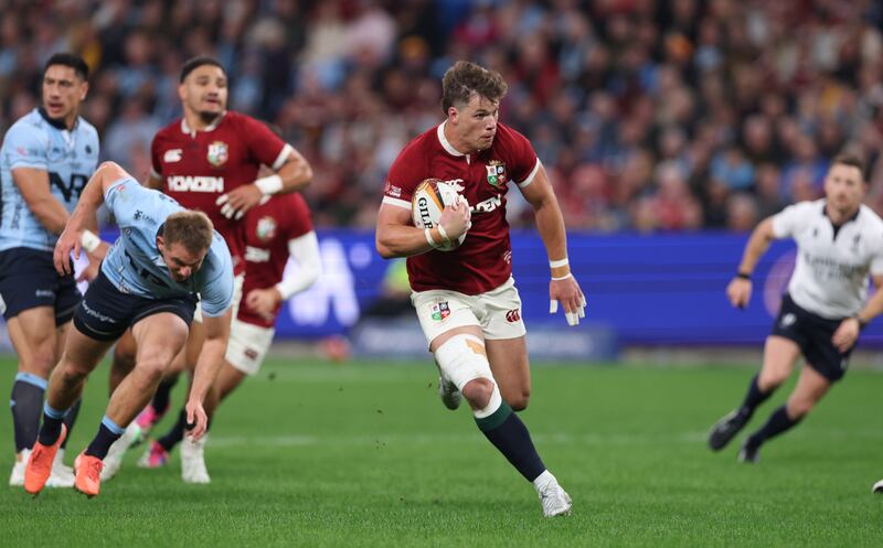 Huw Jones of the British & Irish Lions breaks with the ball to score their first try. Photograph: David Rogers/Getty