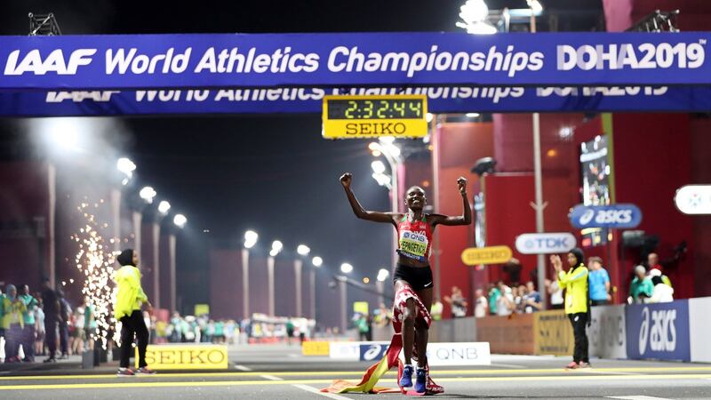 Ruth Chepngetich of Kenya celebrates while crossing the finish line to win the women’s marathon at the IAAF World Athletics Championships at the Al Corniche Water Front in Doha. Photograph: Ali Haider/EPA