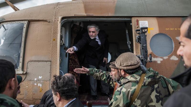 Afghanistan’s chief executive Abdullah Abdullah boards a helicopter after visiting the Yahya Khel district of Afghanistan. Photograph: Bryan Denton/The New York Times