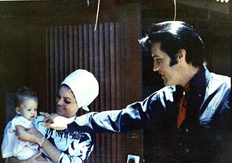 Lisa Marie Presley with her parents Priscilla and Elvis in Graceland, 1968. Photograph: Magma Agency/WireImage