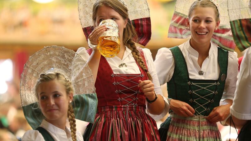 Women wearing regional Bavarian folk dresses celebrate Oktoberfest. Photograph: Sean Gallup/Getty Images