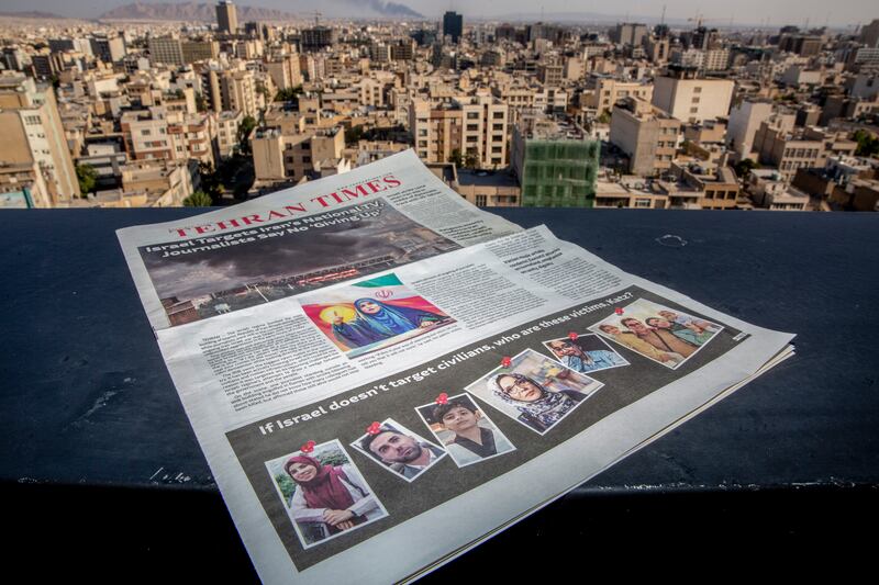 A copy of the Tehran Times newspaper showing people killed in recent Israeli strikes. Photograph: Arash Khamooshi/The New York Times
                      