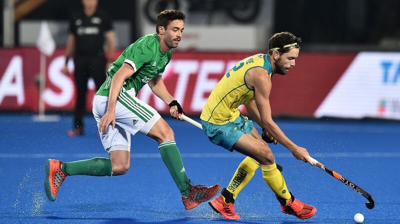Ireland’s Chris Cargo tries to close down Australia’s Flynn Ogilvie during his side’s 2-1 defeat. Photograph: Charles McQuillan/Getty