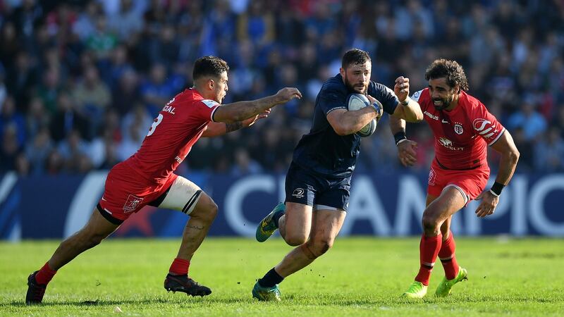 Robbie Henshaw of Leinster makes a break past Sofiane Guitoune and Yoann Huget of Toulouse during their Heineken Champions Cup match in Toulouse on October 21st, 2018. Photograph: Dan Mullan/Getty Images
