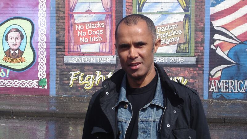 Tim Brannigan in front of a republican mural in 2006