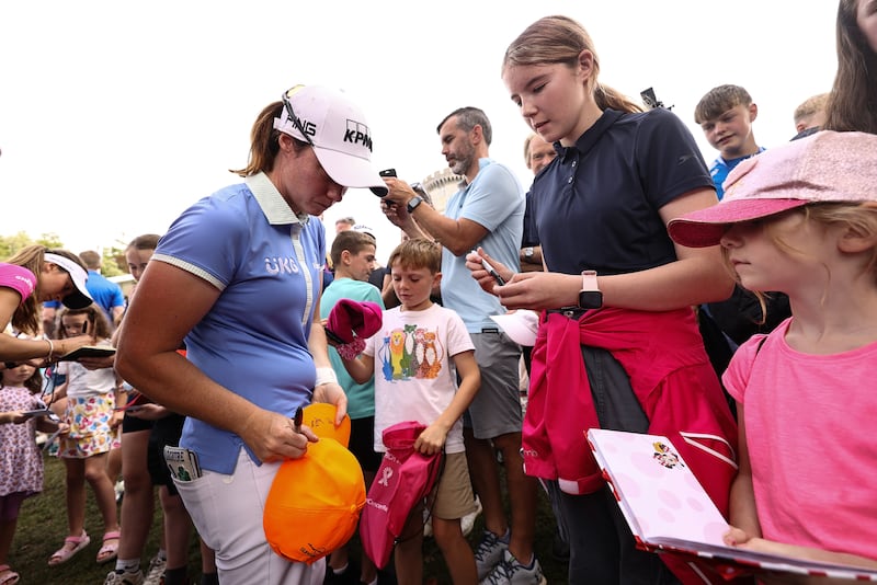 Leona Maguire signs autographs for fans after finishing her round at Drumoland Castle. Photograph: Ben Brady/Inpho